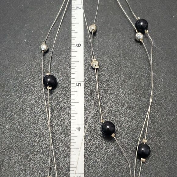 Silver tone black flower floating necklace - Picture 8 of 11